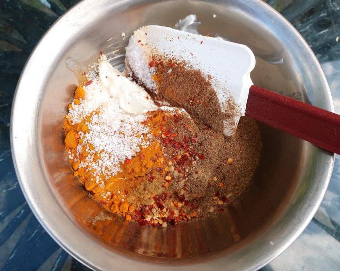 step 1 Mix Greek Yogurt (1 cup), Garam Masala (1 Tbsp), Ground Turmeric (1 Tbsp), Sweet Paprika (1 Tbsp), Granulated Garlic (1/2 tsp), Ground Ginger (1/4 tsp), Ground Coriander (1 tsp), Ground Cumin (1 tsp), Crushed Red Pepper Flakes (to taste), and Kosher Salt (to taste).