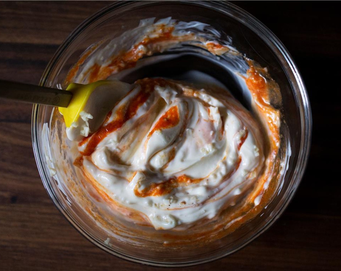 step 1 To make the sriracha sauce aioli; in a small bowl add the Mayonnaise (1/2 cup), Garlic (2 cloves), Kosher Salt (1 Tbsp), Cayenne Pepper (1 pinch), and Sriracha (1 tsp) sauce. Stir well to combine. Refrigerate until serving.