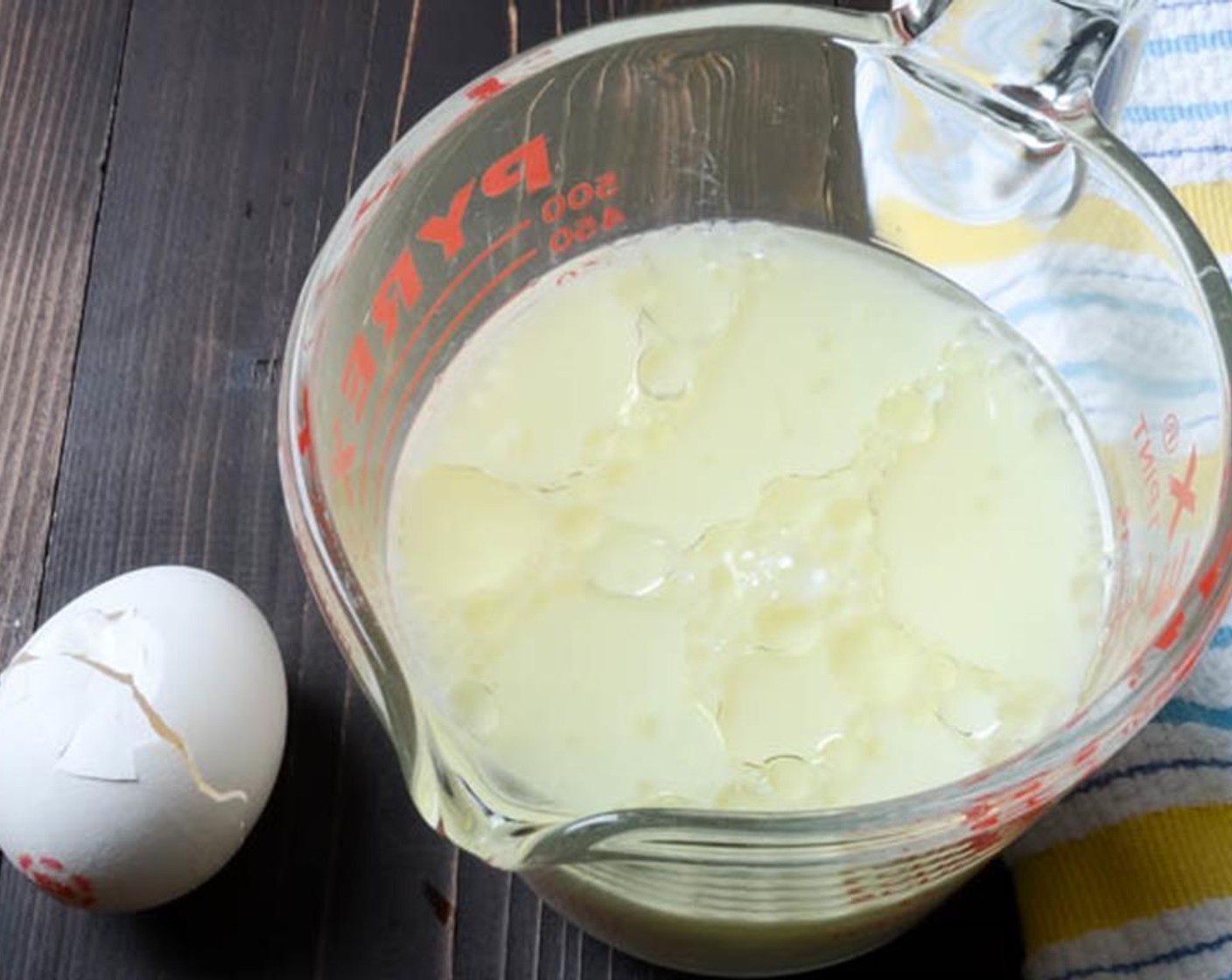 step 3 In a small bowl or two-cup measuring cup, add the Milk (1 1/2 cups), Egg (1) and Vegetable Oil (2 Tbsp). Whisk to combine.