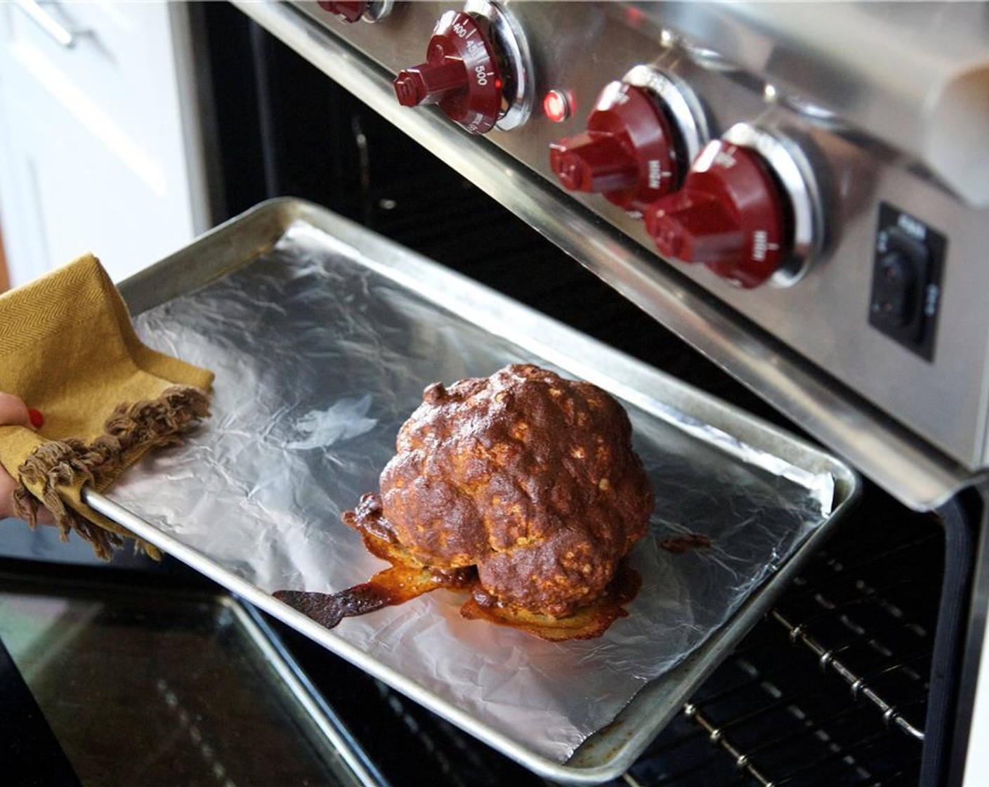 step 5 Place the cauliflower on a foil lined sheet pan and roast in the oven until the surface is dry and slightly browned, for 30 minutes.