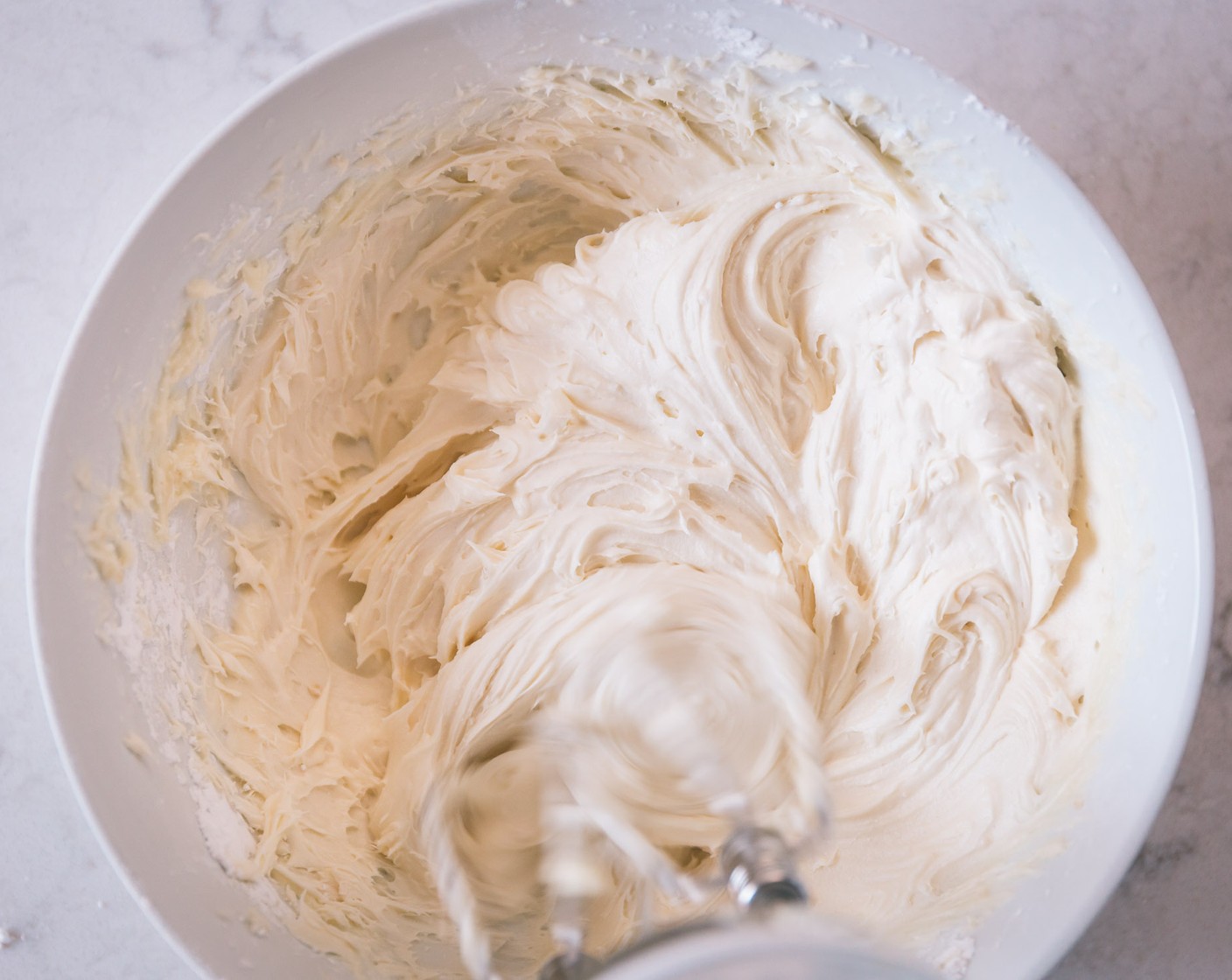 step 13 In a standing mixer, cream the Cream Cheese (1/2 cup) and Butter (1/4 cup) together until smooth. Add the Powdered Confectioners Sugar (2 cups) and Vanilla Extract (1 tsp) and beat until a smooth frosting appears. Place into a large zip lock bag and cut the corner off one of the edges.