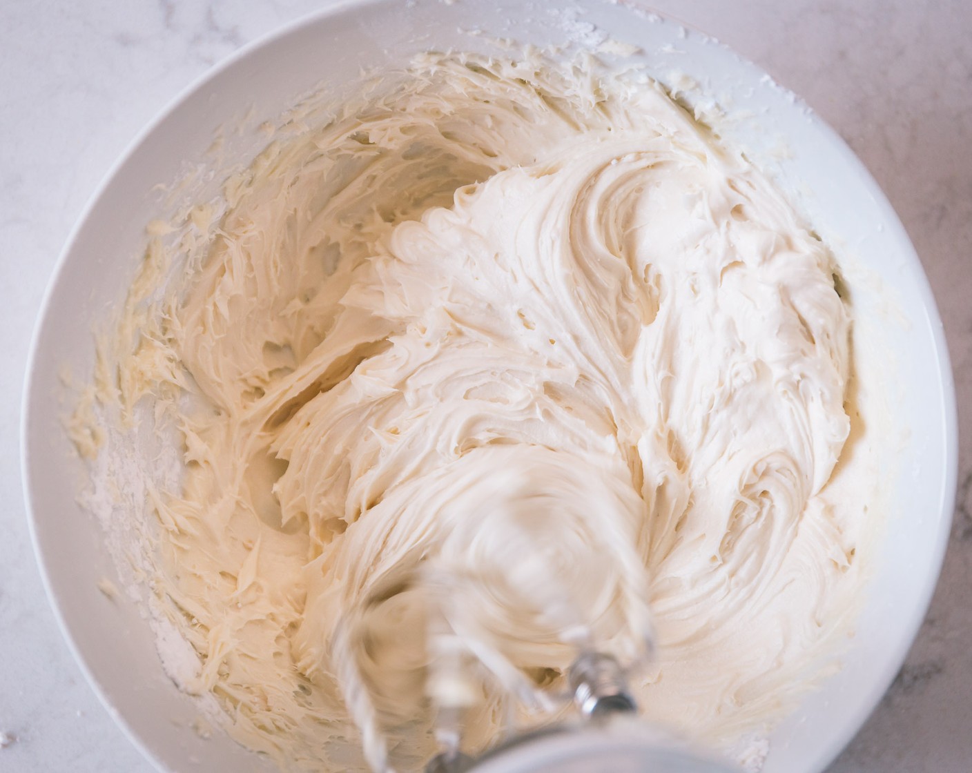 step 13 In a standing mixer, cream the Cream Cheese (1/2 cup) and Butter (4 Tbsp) together until smooth. Add the Powdered Confectioners Sugar (2 cups) and Vanilla Extract (1 tsp) and beat until a smooth frosting appears. Place into a large zip lock bag and cut the corner off one of the edges.
