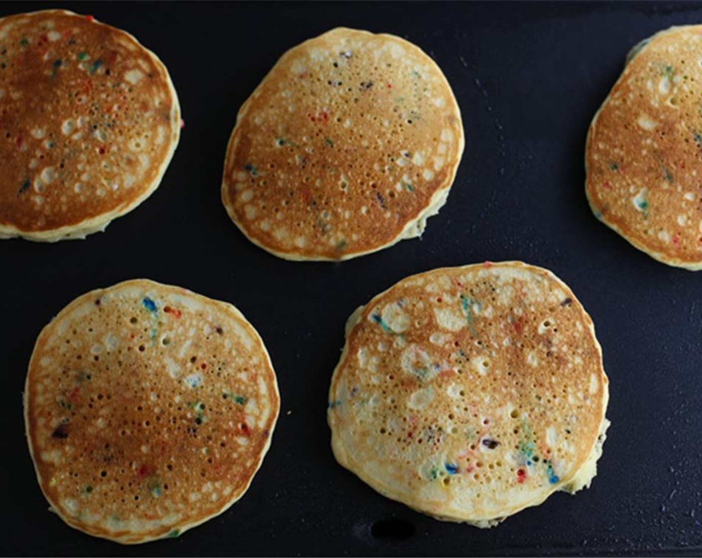 step 4 When you see little bubbles form, flip the pancakes (about a minute). Fry the other side of the pancakes for 30-60 seconds or until golden brown.