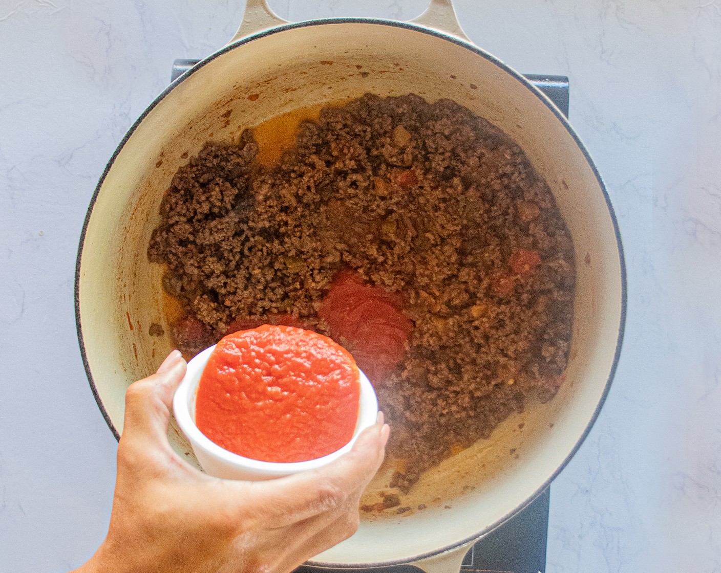 step 5 Add the Tomato Paste (1/2 Tbsp) and stir until it’s dissolved into the meat.