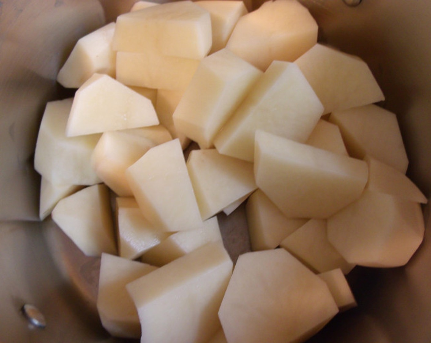 step 7 Meanwhile, cook Potatoes (2 lb) in salted water and drain.