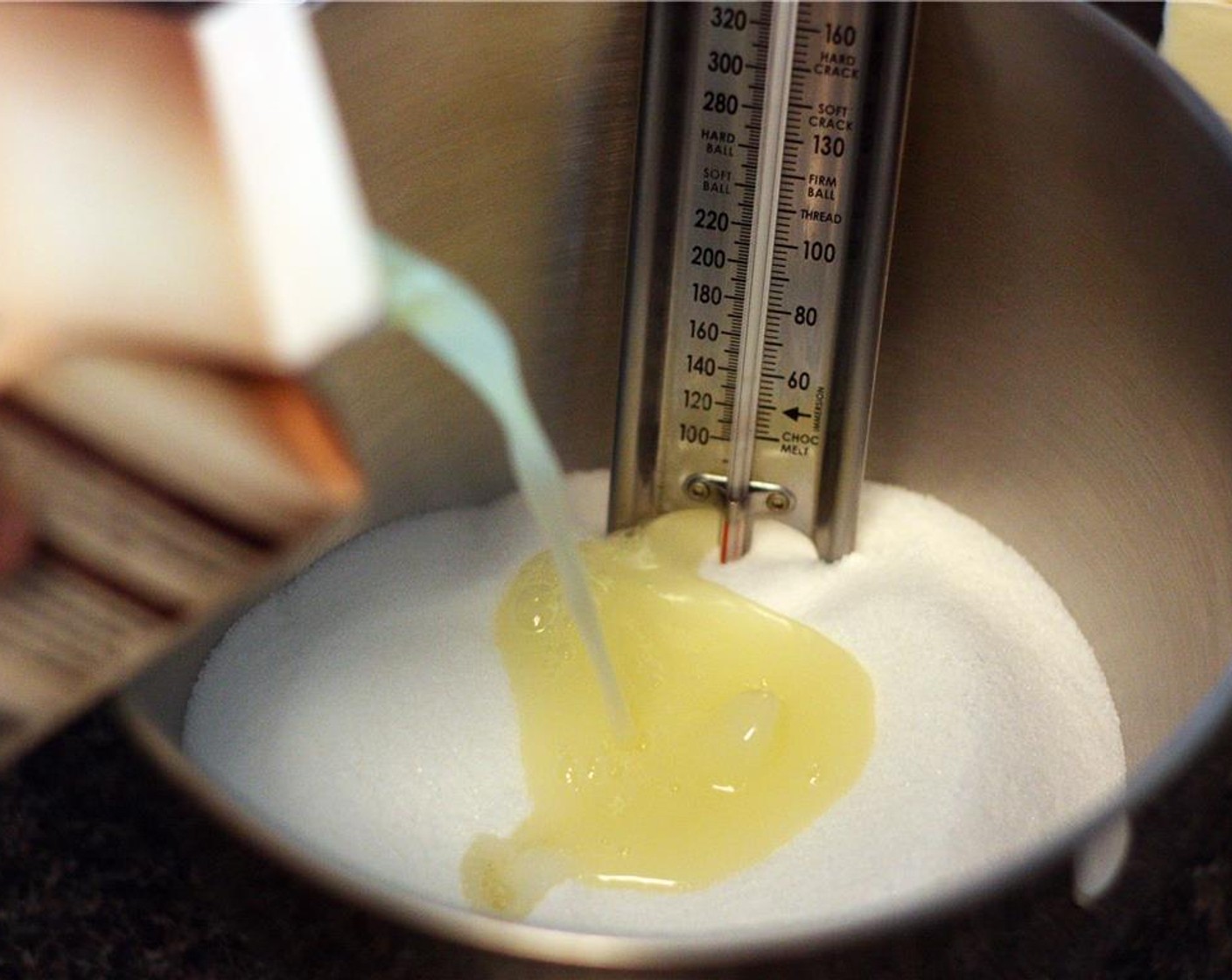 step 2 Measure Granulated Sugar (3 3/4 cups) the mixer bowl using a food scale. Add the Eggs (1 3/4 cups) to the sugar and position the candy thermometer into the mixer bowl. Set aside.