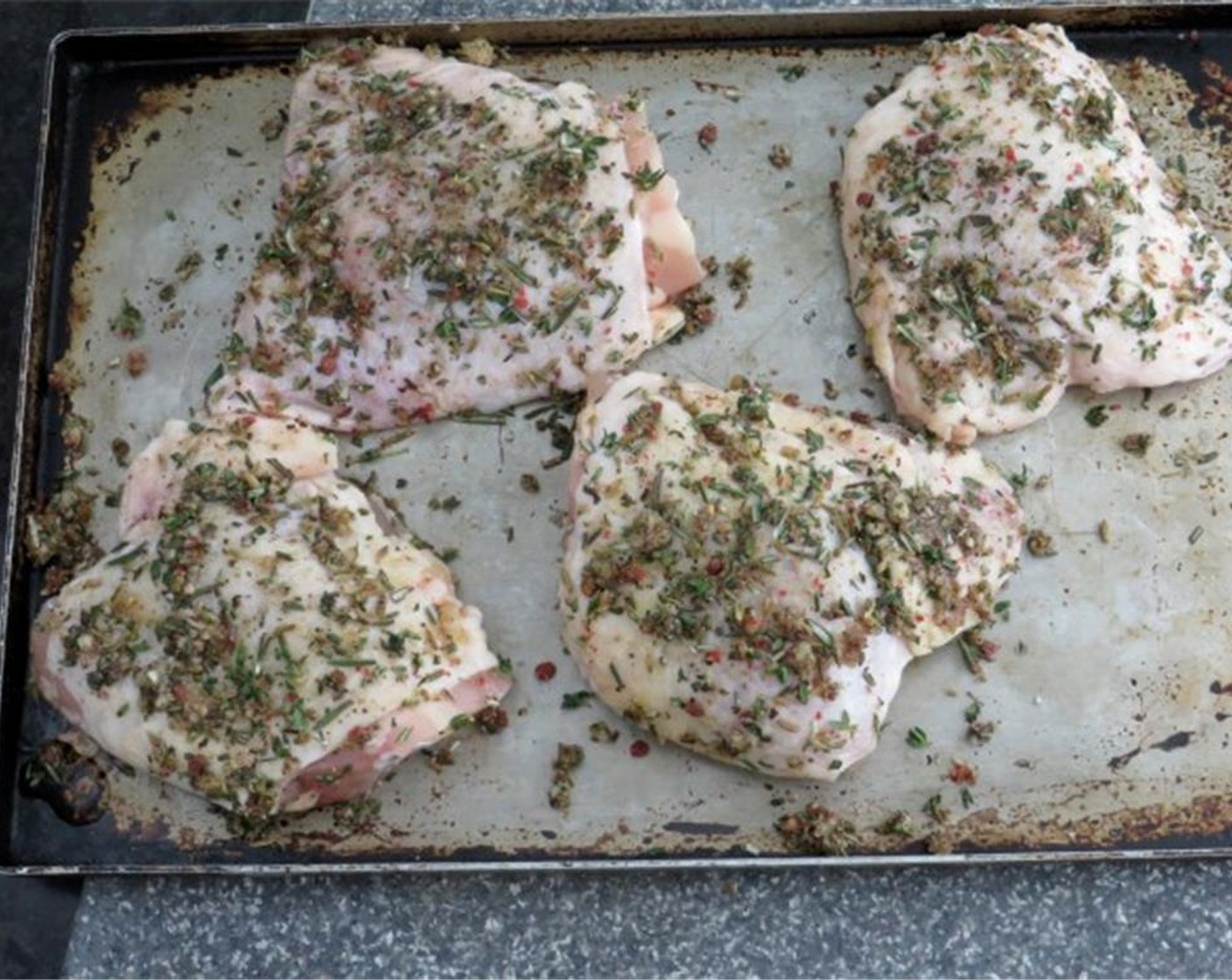 step 4 Liberally sprinkle herb rub onto both sides of chicken. Press the rub in with your fingers, so that it adheres to the chicken. Place chicken on a platter and transfer to the refrigerator to marinate for at least two hours and up to eight.