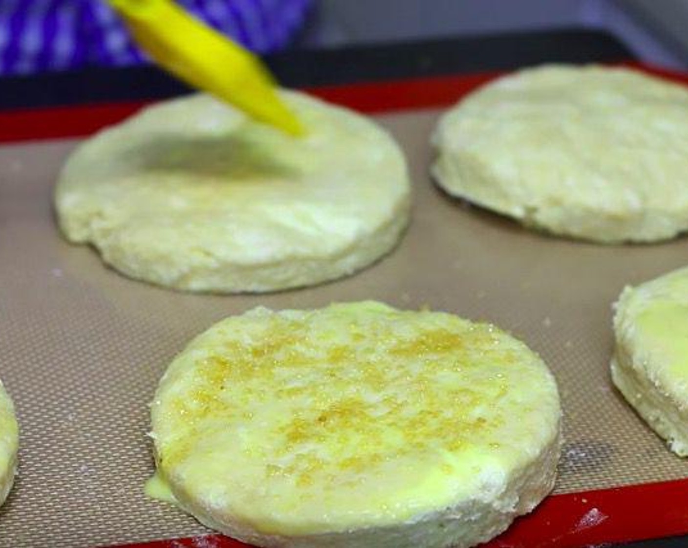 step 3 Put the dough into a floured surface and press it down. Take a biscuit cutter and cut the dough.