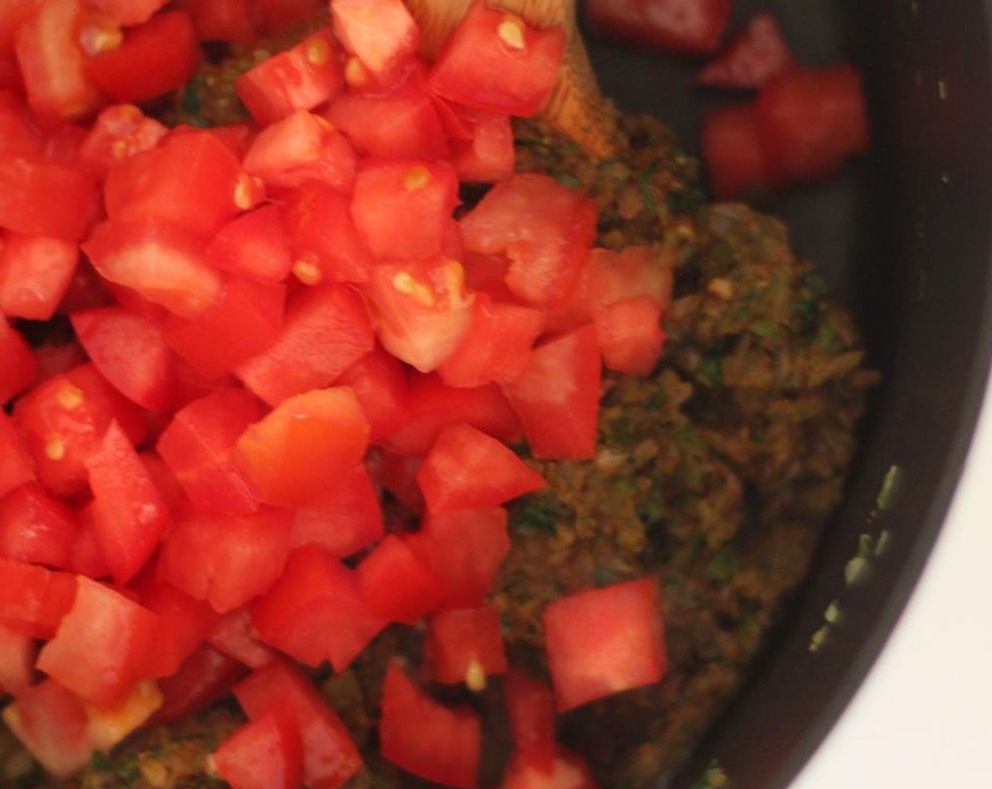 step 6 Once it comes together, add the Tomatoes (3) and cook until softened.