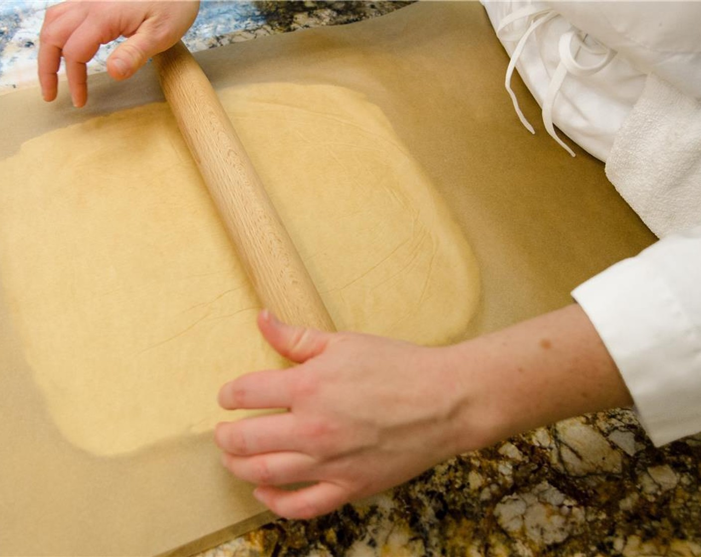 step 6 Roll the unwrapped dough between two pieces of plastic wrap or parchment paper to a square twice the size of the butter block.