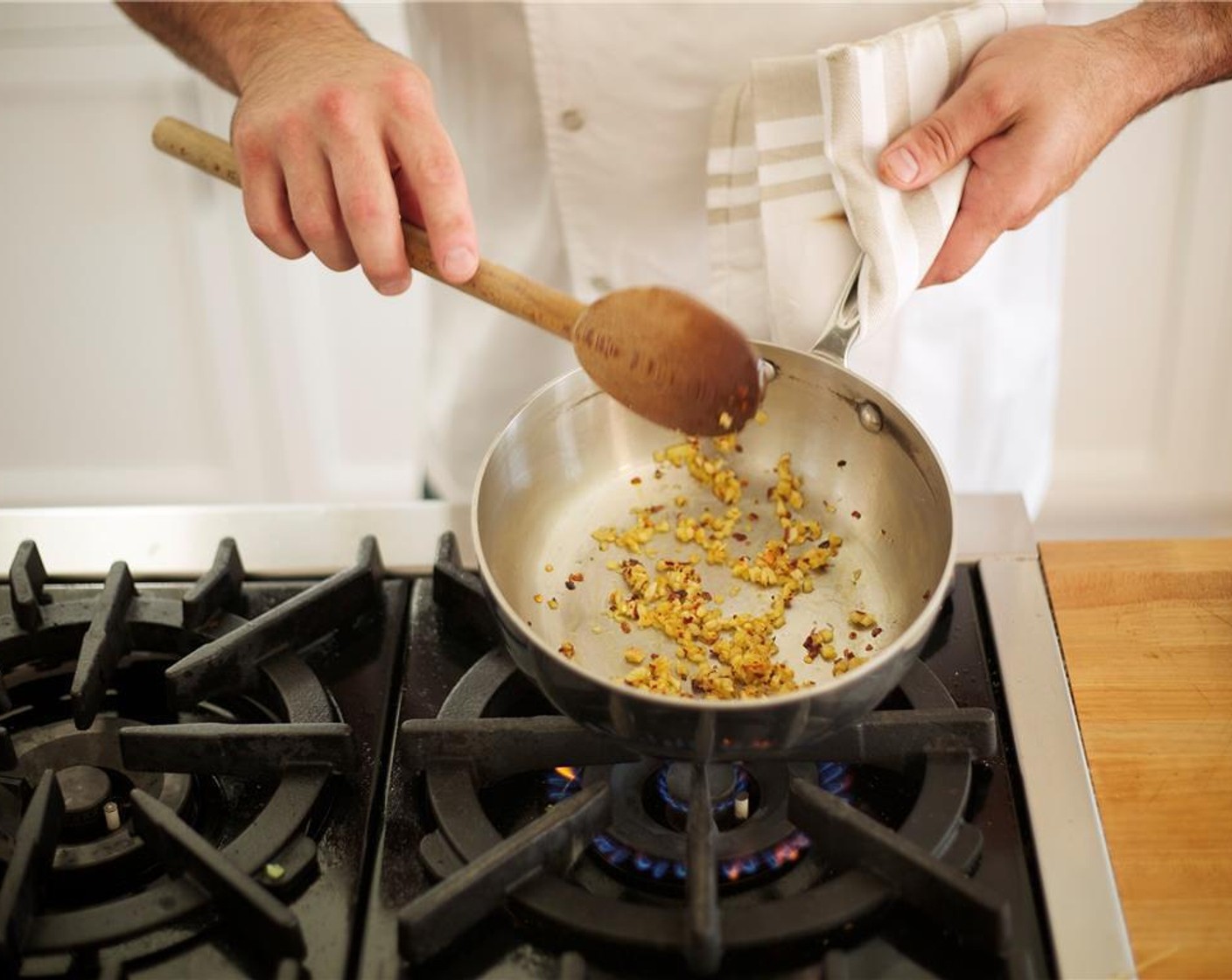 step 1 Heat a large saucepan over medium low heat. Add Olive Oil (1/2 Tbsp). Add Fresh Ginger (2 Tbsp), Garlic (1 clove), Crushed Red Pepper Flakes (1/2 tsp) and cook, stirring until fragrant, about one minute.