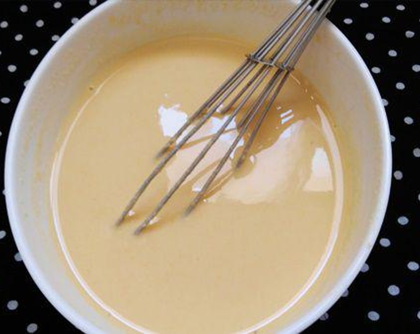 step 2 In a bowl, add Salt (1 pinch) to Chickpea Flour (1 cup) and mix well. Stir in Water (1/2 cup). The batter should be smooth and neither be too thick or thin. It should have a flowing consistency.