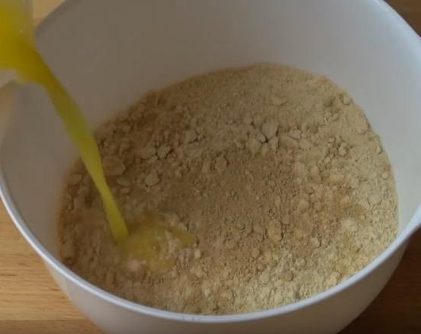 step 1 In a mixing bowl, add Graham Crackers (3 cups), Ground Ginger (1/2 Tbsp), and Butter (1/2 cup). Stir until ingredients come together.