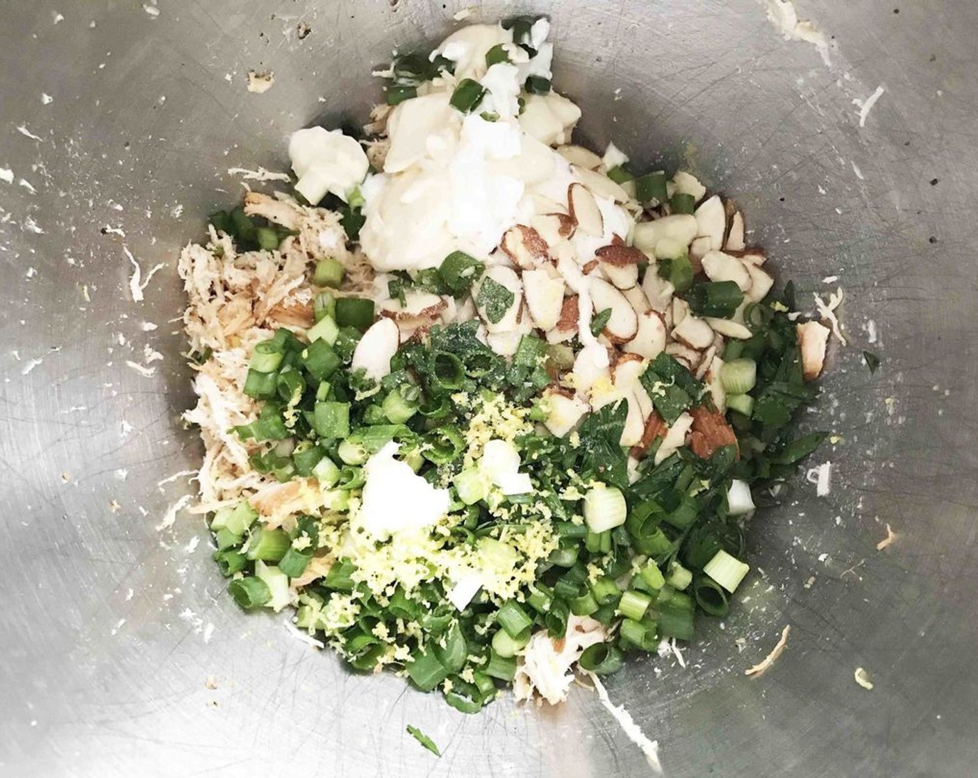 step 4 Allow the chicken to cool slightly before mixing with Fat-Free Greek Yogurt (3/4 cup), Almonds (1/2 cup), Fresh Parsley (1/4 cup), Scallion (1 bunch), Light Mayonnaise (2 Tbsp), and zest and juice from the Lemon (1/2)
