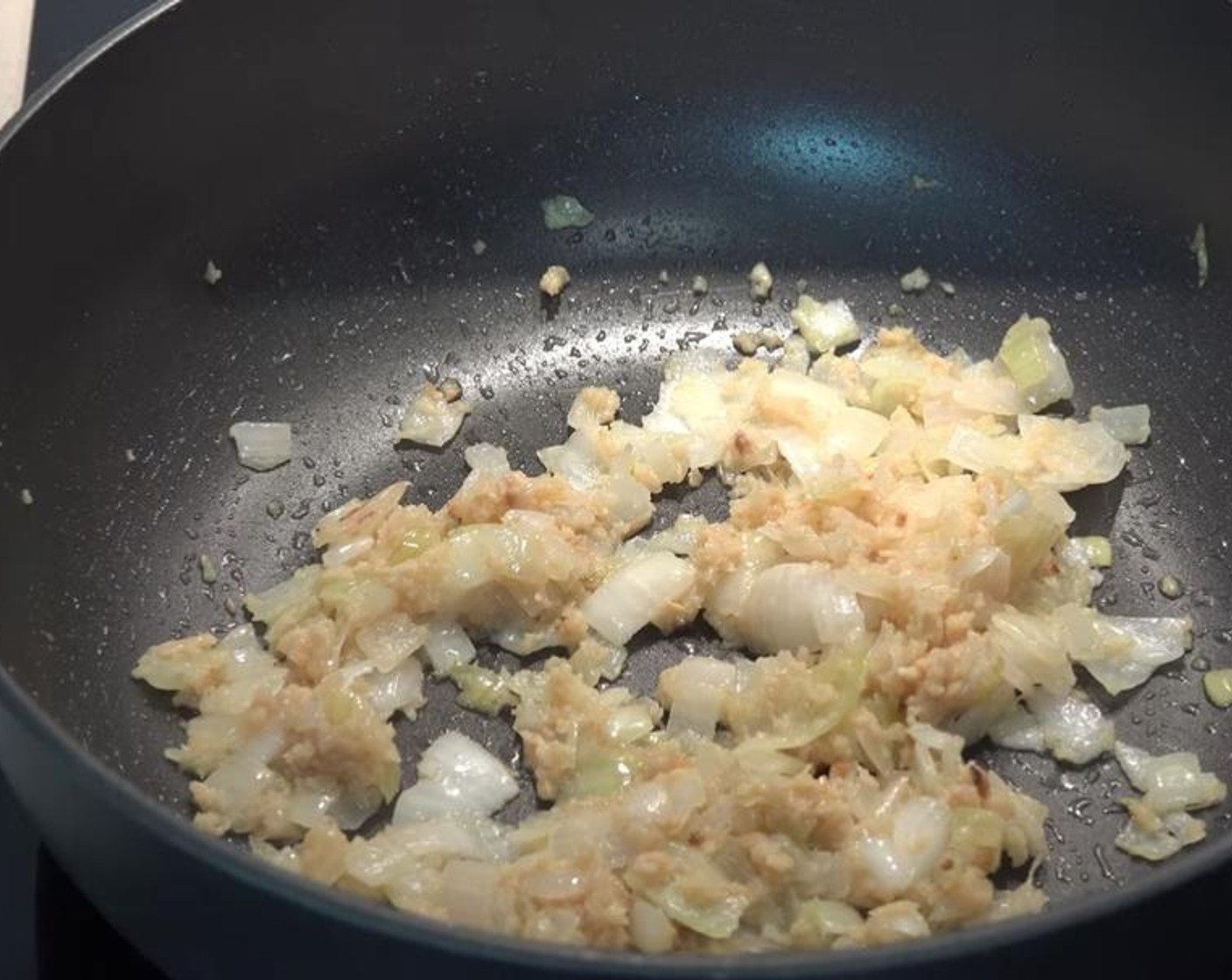 step 2 Add in the Garlic (4 cloves). Stir for a few minutes, until aromatic.