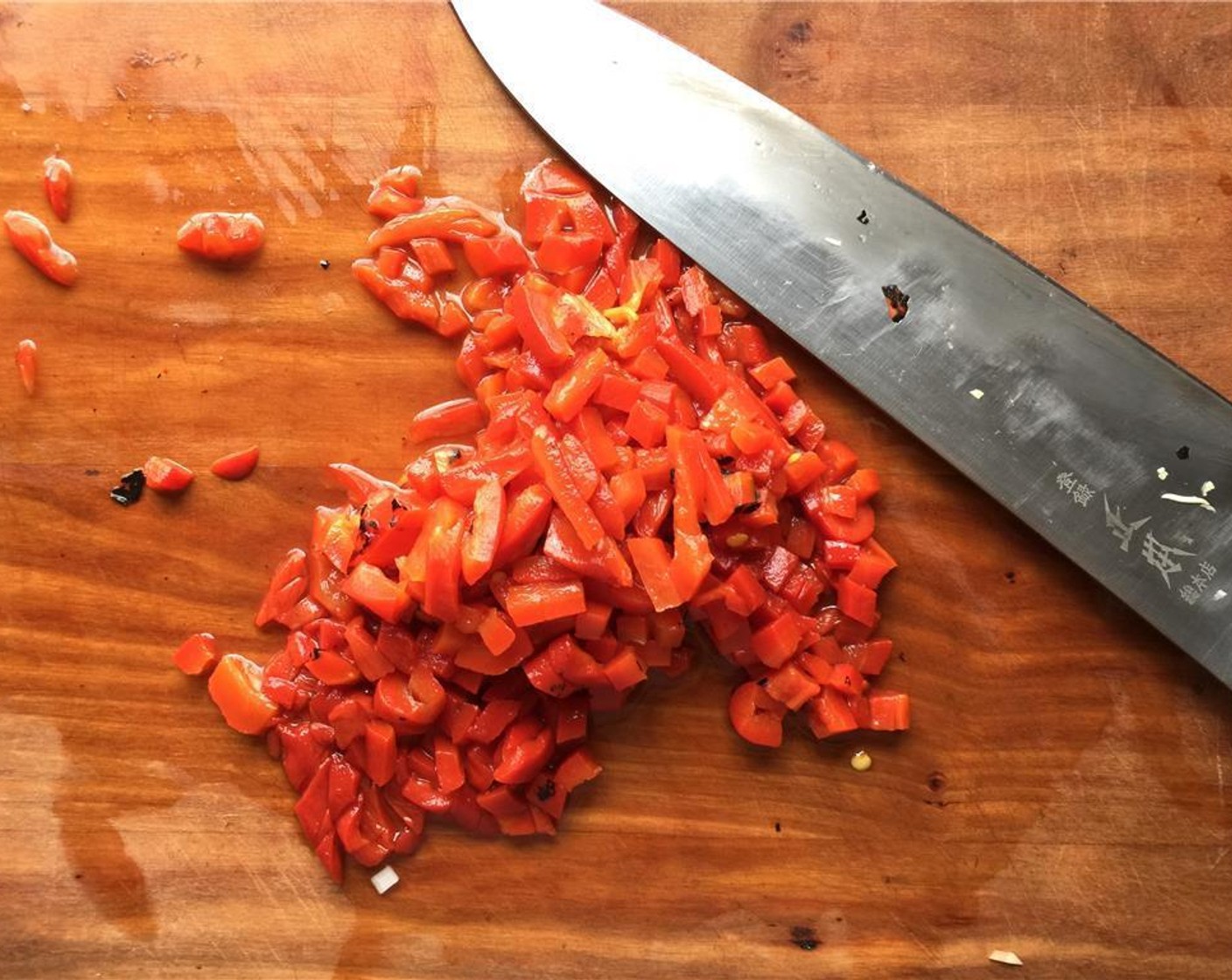 step 6 Drain the Jarred Roasted Red Peppers (2) before chopping. Set aside.