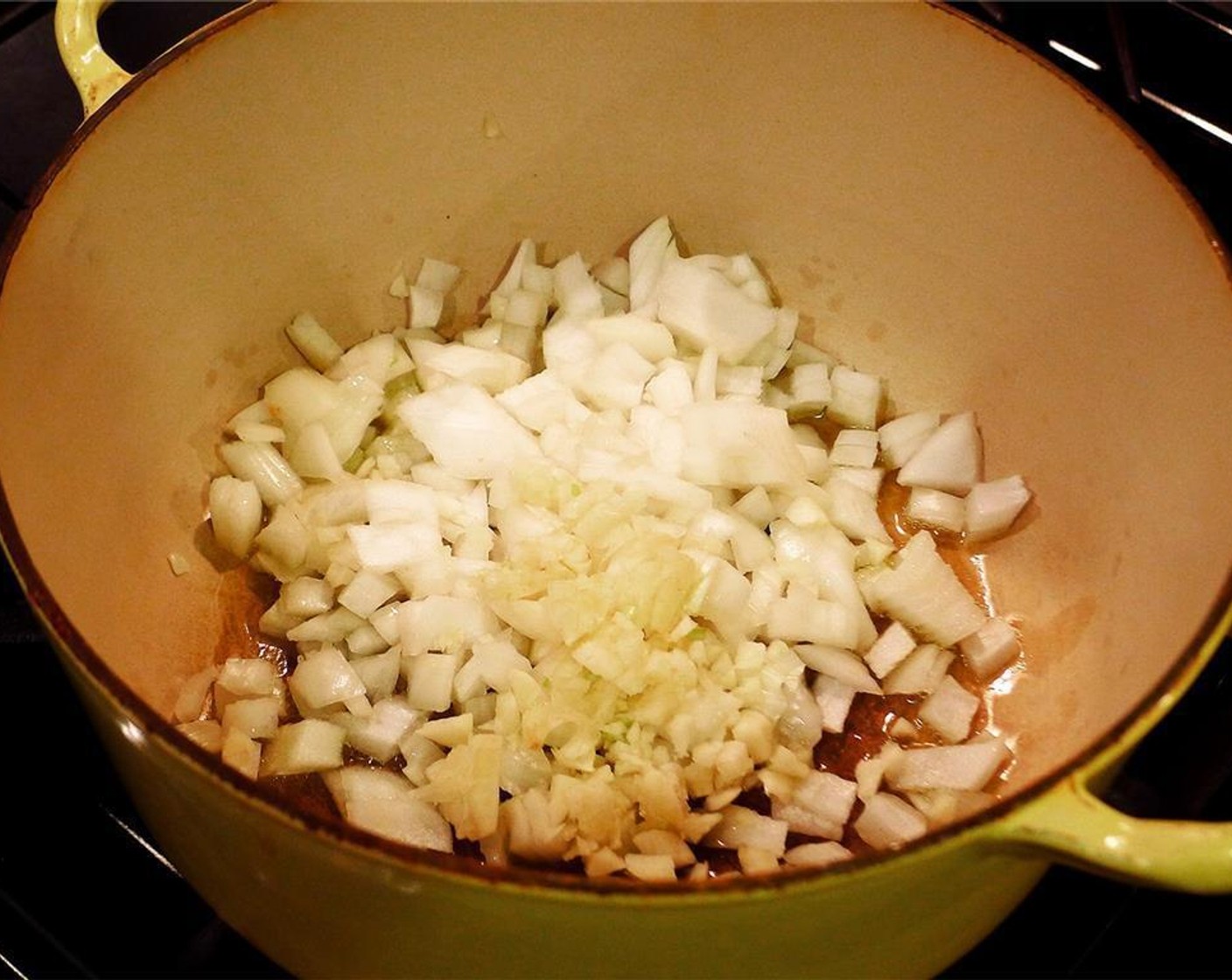 step 1 Heat the Olive Oil (2 Tbsp) in a large pot over medium-low heat and gently cook the Garlic (3 cloves) and Onion (1) for about 5 minutes, until soft and translucent.