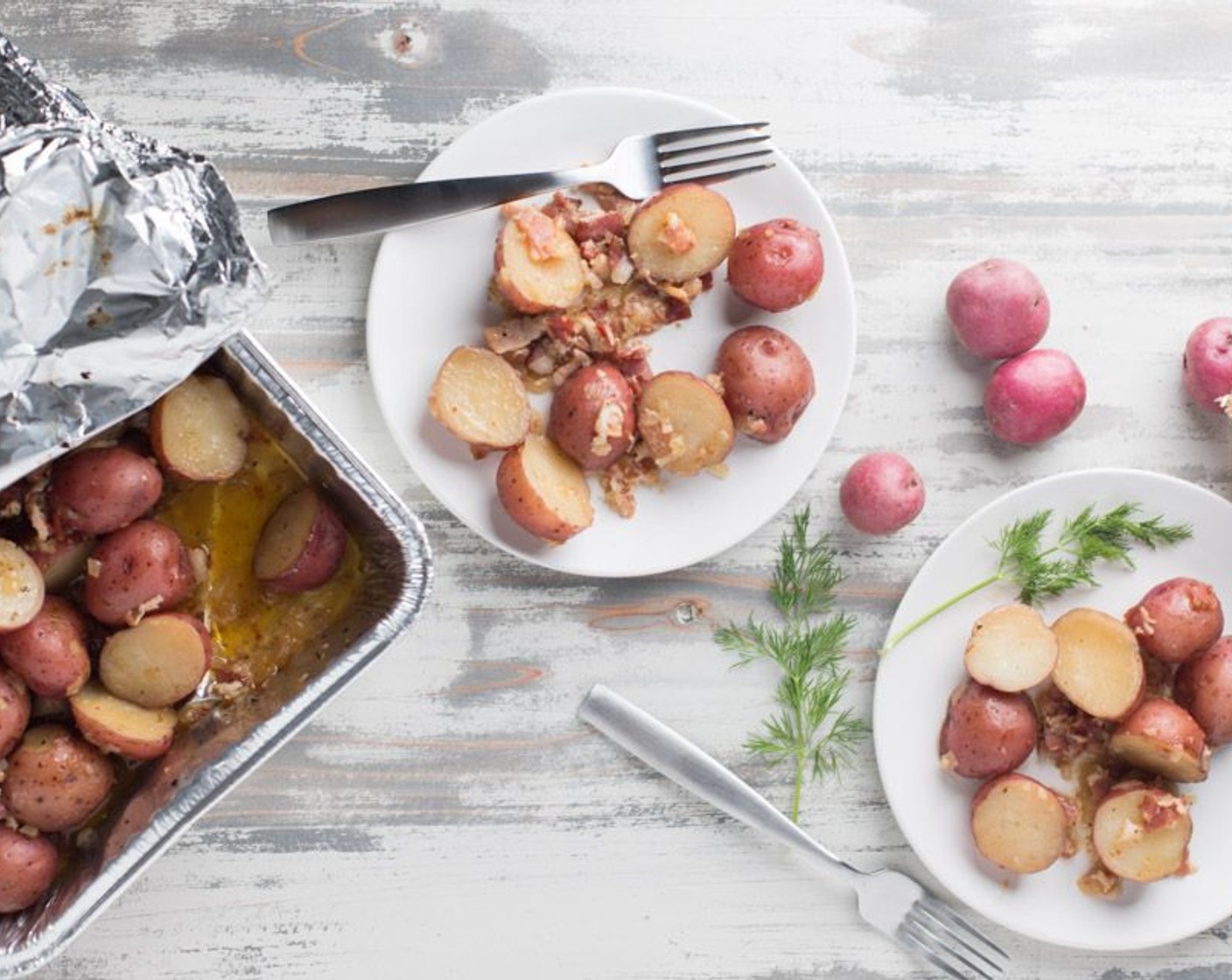 step 9 Roast at 375 degrees F (190 degrees C) for 2 hours, stirring approximately every 30 minutes to prevent potatoes from burning. Check for doneness of potatoes by jabbing one with a fork (it should be soft and some browning on the outer part of the pan). Serve wamr.