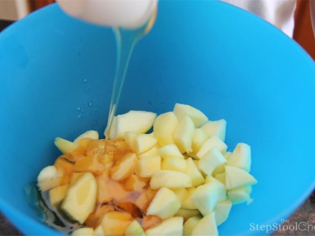 Step 4 of Yummy Dutch Apple Crisps Recipe: Combine the diced apple, Honey (1/2 cup), Vanilla Extract (1 teaspoon), lemon juice, Ground Cinnamon (1 1/2 teaspoon), and Ground Nutmeg (1/4 teaspoon) in a bowl and set aside. This is the filling.