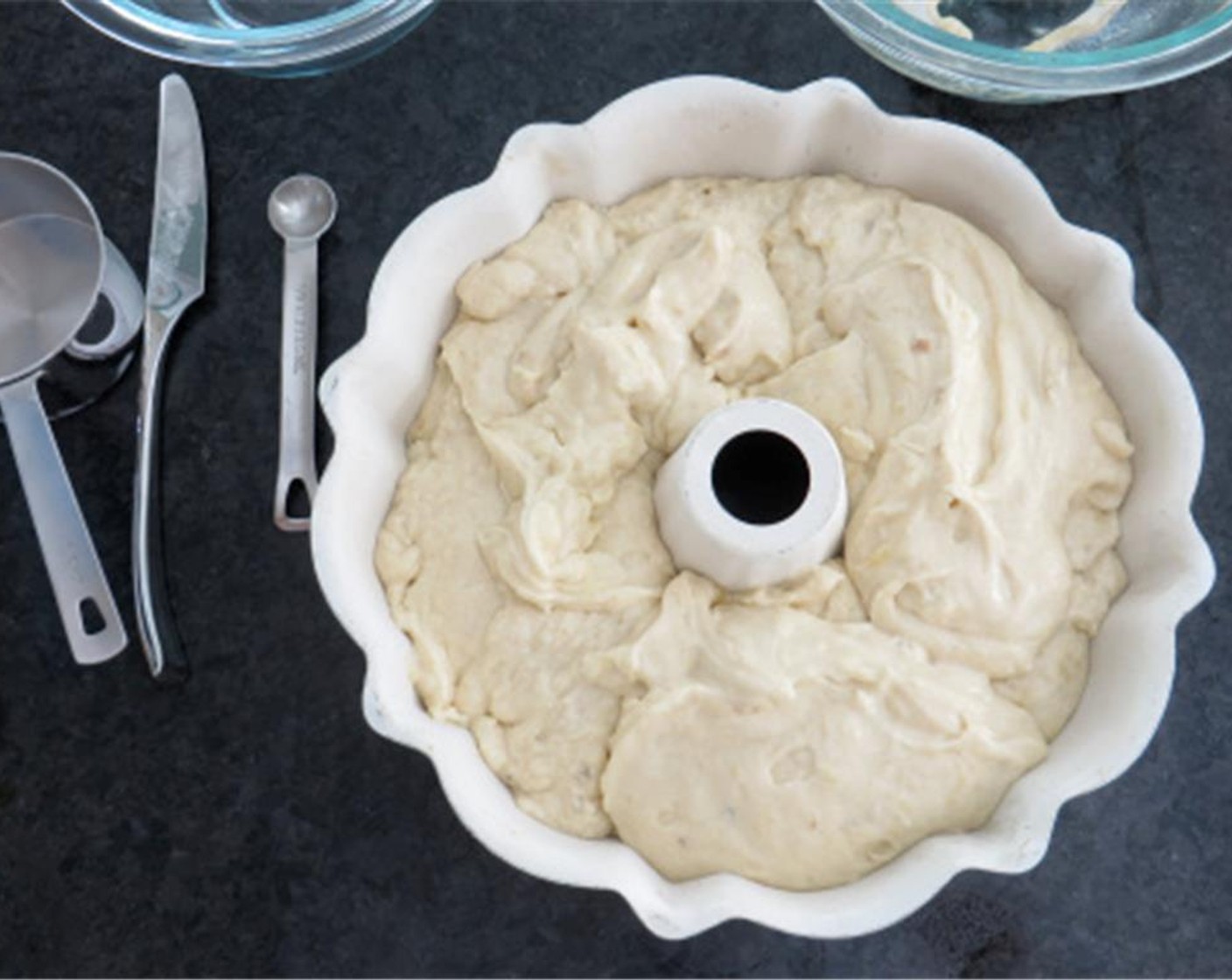 step 7 Pour batter into prepared pan and bake in preheated oven for 1 hour and 40 minutes, or until a toothpick inserted in the center of cake comes out clean.