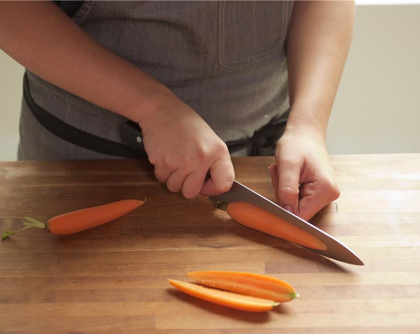 step 1 Set oven to broil on high. Cut the Baby Bok Choy (2) in half lengthwise, and set aside. Cut the French Baby Carrots (6) in half lengthwise, and set aside.