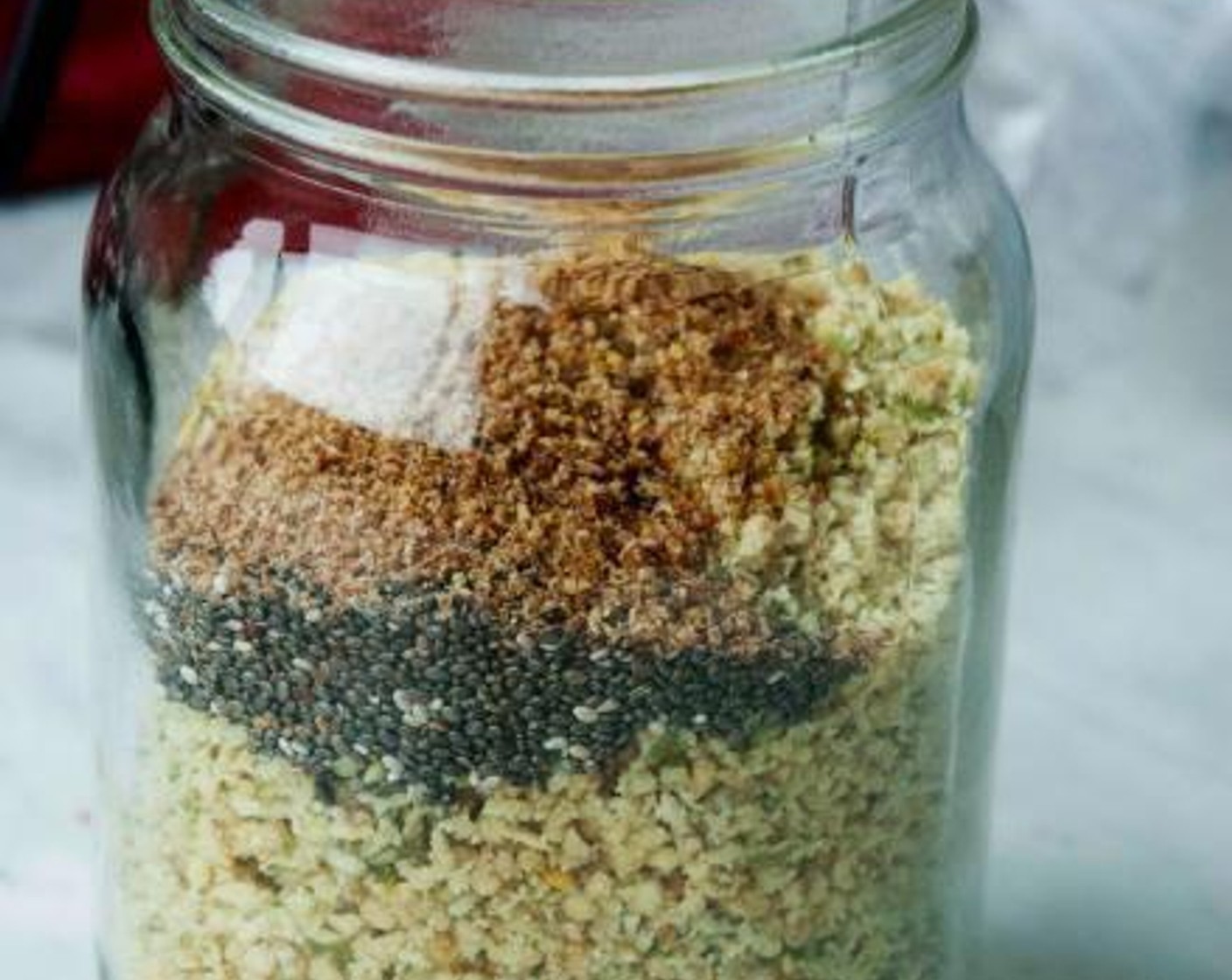 step 2 Transfer the ground walnuts and pumpkin seeds to a jar along with the Ground Flaxseed (1 tsp) and Chia Seeds (1 tsp).