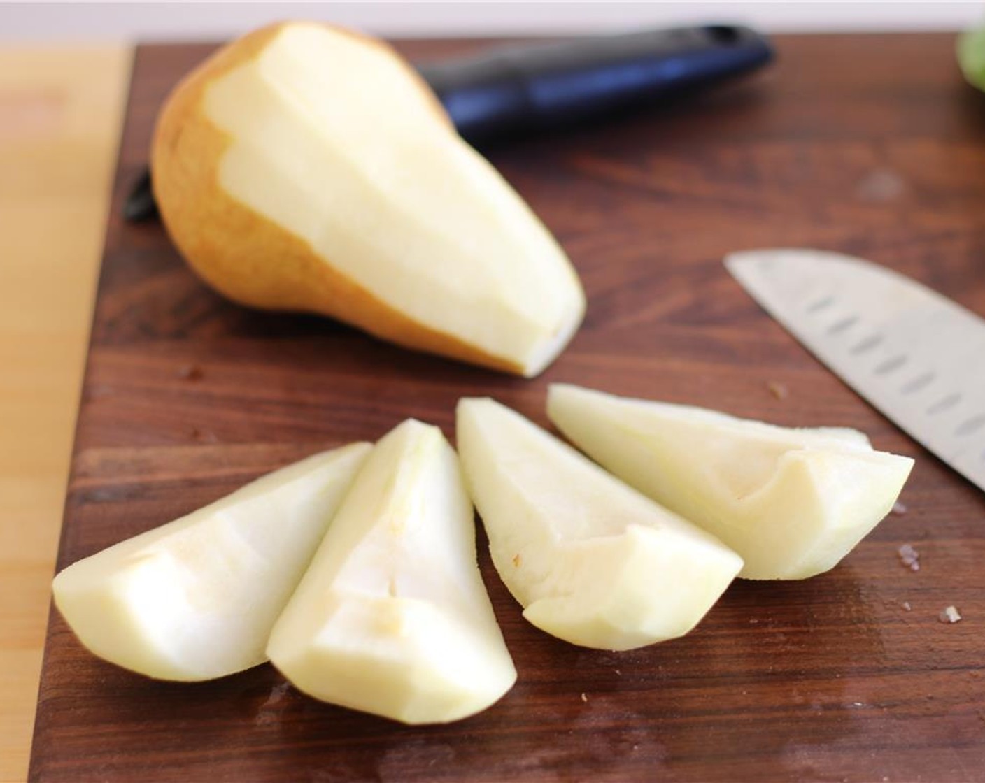 step 2 Peel the Bosc Pears (2). Quarter them and remove the core.