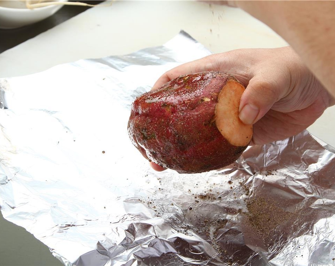 step 5 Preheat your oven to 180 degrees C (350 degrees F). Toss Sweet Potatoes (1.1 lb) in Oil (as needed) and Salt (to taste) and Ground Black Pepper (to taste).