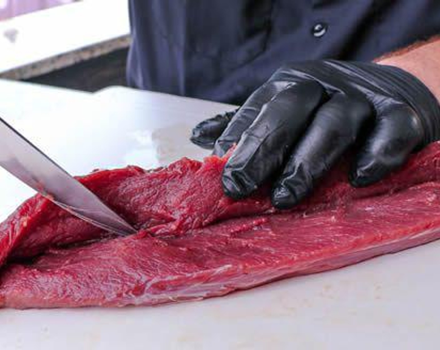 step 4 Trim excess silver skin from Venison Backstrap (2) and cut a slit down the length to butterfly it open. Be careful not to cut through the entire piece.