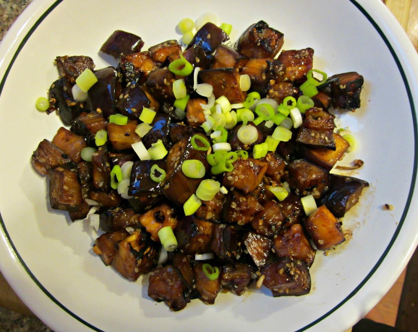 step 8 Carefully taste little bites while cooking to make sure you're cooking it thoroughly but not to mush. Once cooked, remove from heat and top with Scallion (1 Tbsp) and Toasted White Sesame Seeds (1 Tbsp).