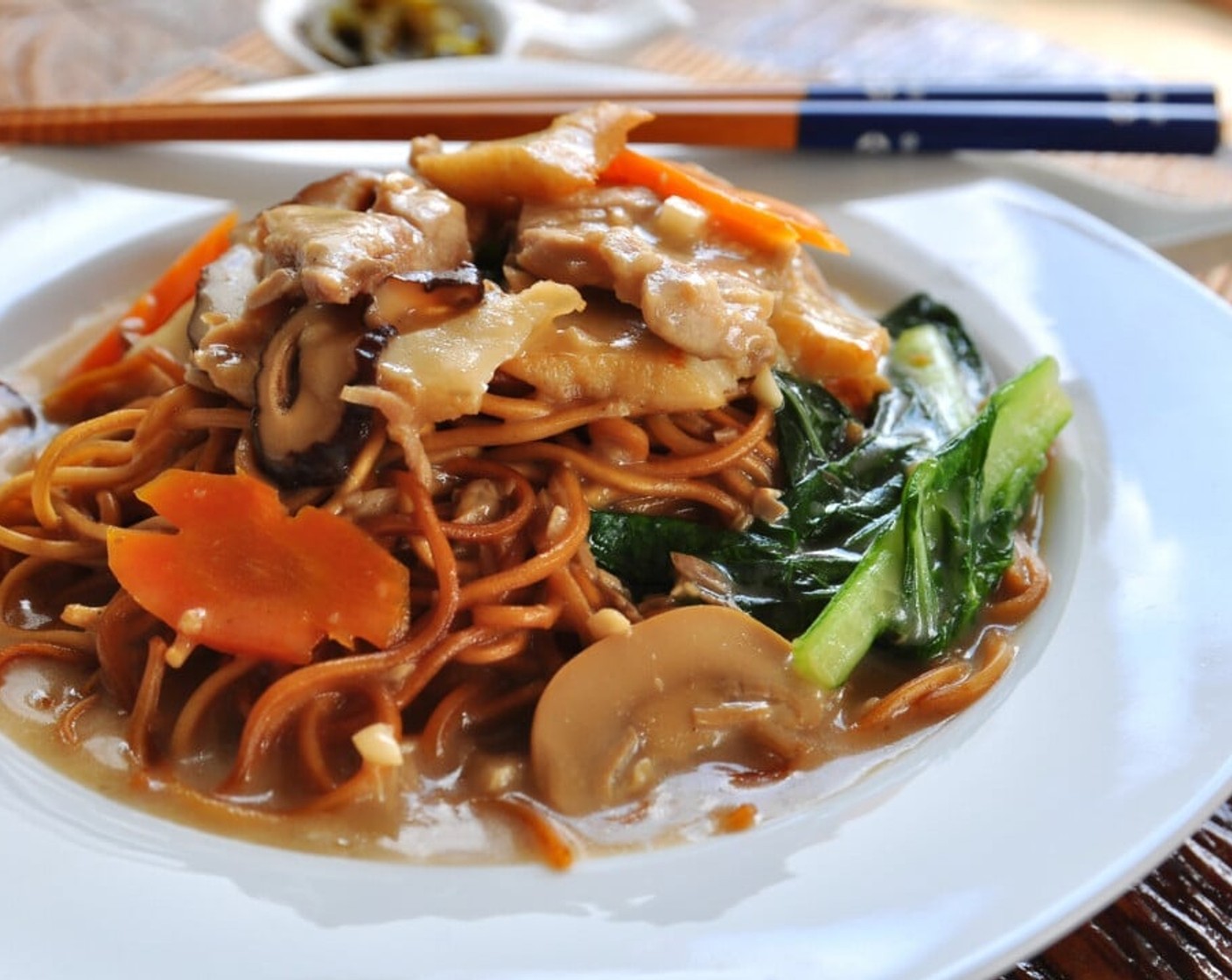 step 13 Using a ladle, pour the gravy onto the prepared egg noodles on the serving plate and serve immediately. Enjoy!