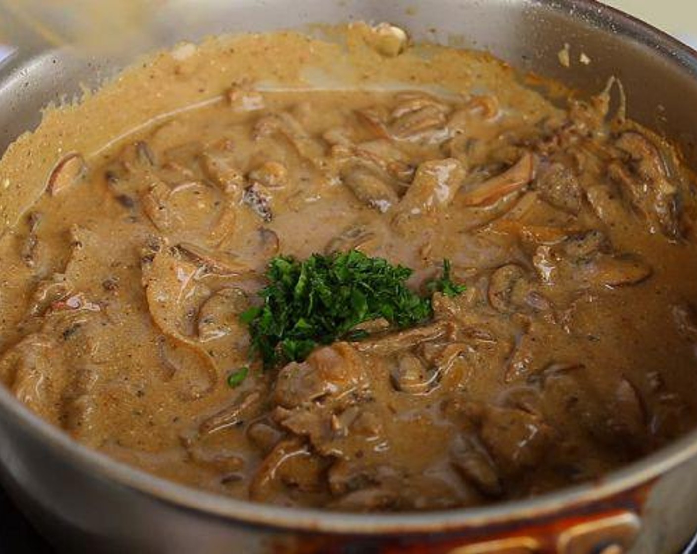 step 5 Add Sour Cream (1/2 cup) and stir together until combined. Add back the beef.and some Fresh Parsley (1 Tbsp). Mix thoroughly. Serve with pasta or rice.