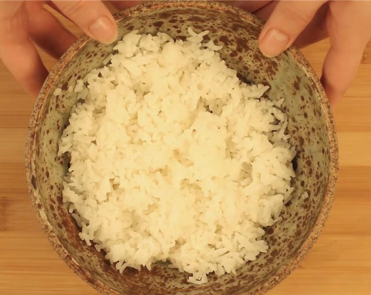 step 4 Divide the cooked White Rice (2 1/2 Tbsp) between two bowls.