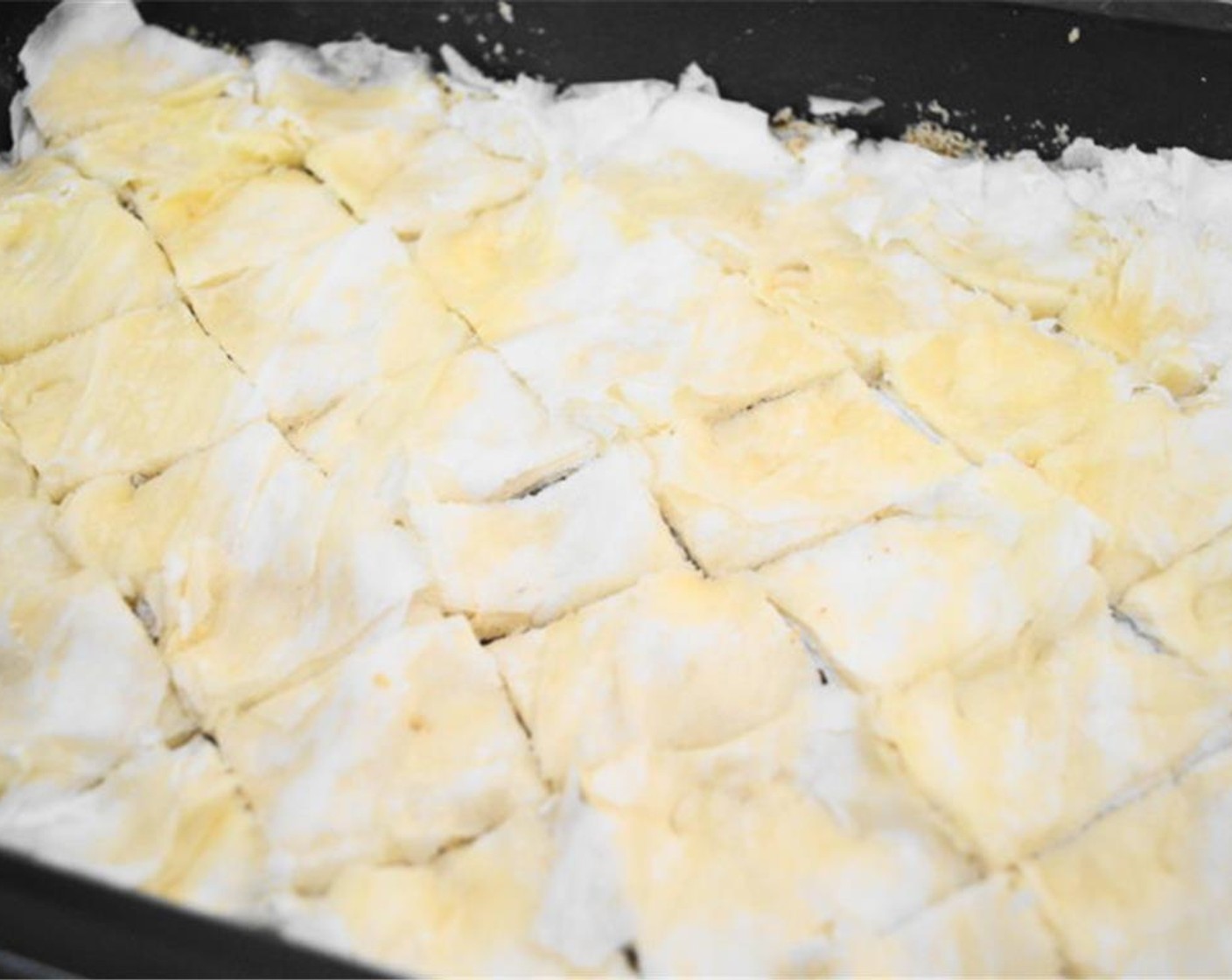 step 6 With a sharp knife, cut diagonal parallel lines from one side of the pan to the other. Then cut the same lines going the opposite way to cut the baklava into the classic diamond shapes.