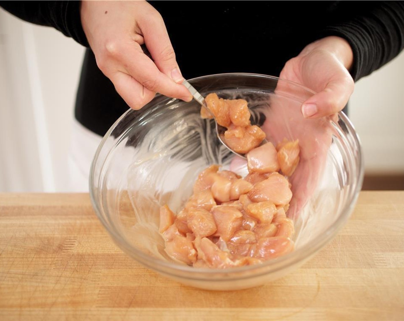 step 4 In a large bowl, combine the cubed chicken, Corn Starch (1 Tbsp), Gluten-Free Tamari Soy Sauce (1 Tbsp), and Sesame Oil (1 tsp). Marinate for 10 minutes.