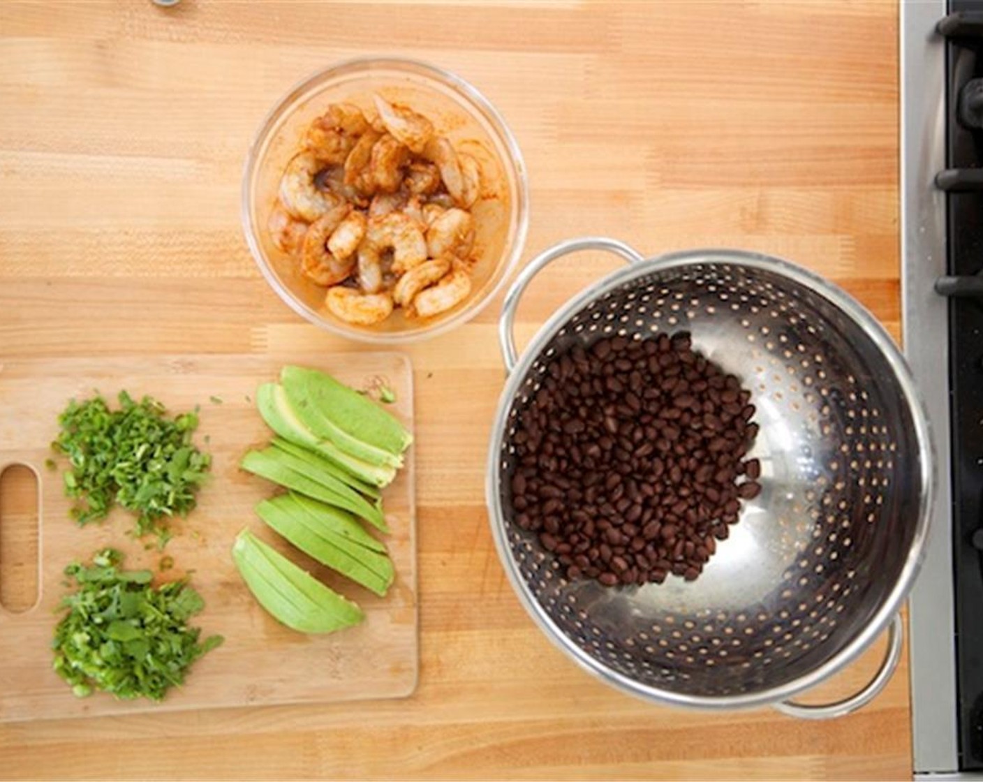 step 3 Using paper towels, pat dry Shrimp (20) and add to the marinade. Toss until evenly coated. Drain and rinse Canned Black Beans (2 1/3 cups) and hold. Finely slice the Scallions (4 stalks), and divide in half. Add half to beans and set aside remaining half.