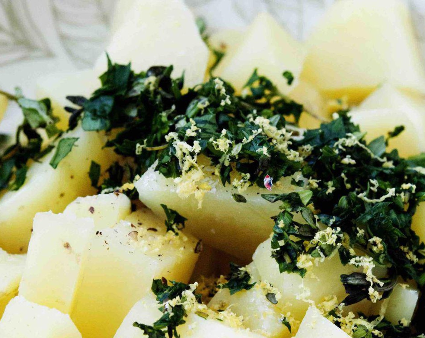 step 4 Add the Fresh Thyme Leaves (to taste), Dried Oregano (1 tsp), and lemon zest to the potatoes. Mash the mixture well.