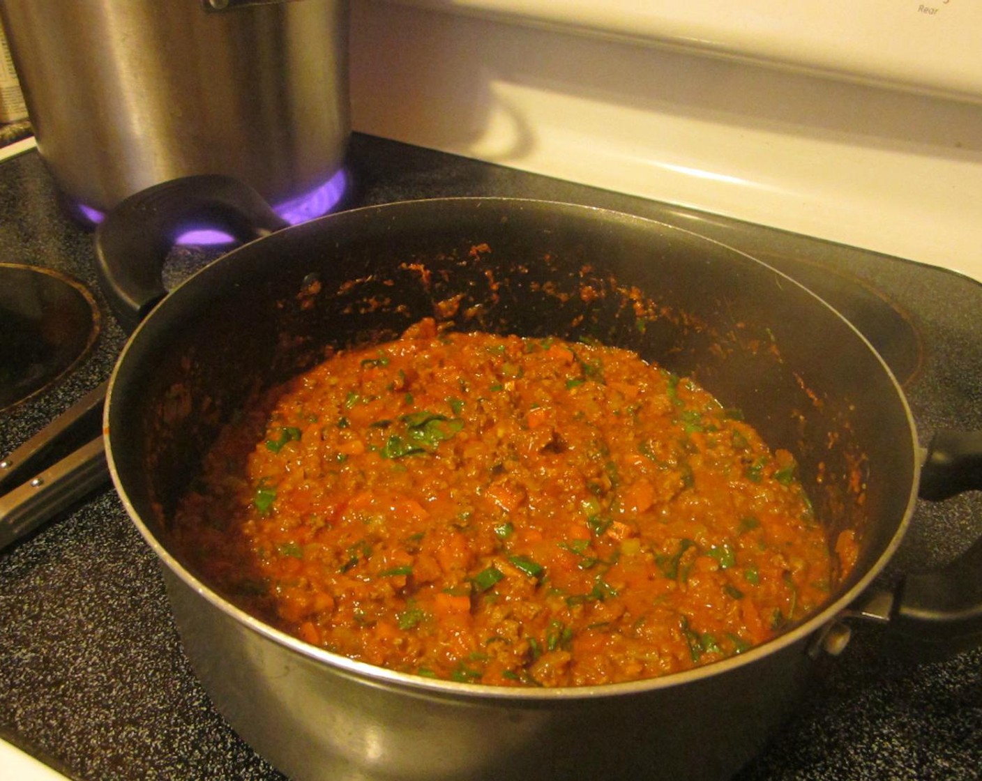step 8 Add Fresh Spinach (1 cup), Fresh Parsley (1 cup), Fresh Basil (1/2 cup), Fresh Thyme Leaves (1 Tbsp), Salt (1 tsp), Ground Black Pepper (1/2 tsp) and Dried Oregano (2 tsp) to the sauce. Continue to simmer on low until the pasta is done.