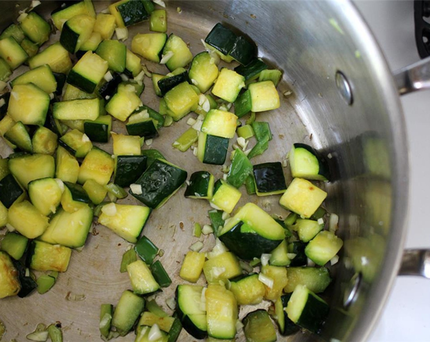 step 1 Roughly chop the Summer Squash (2 cups). Heat a soup pot over medium-low. Add Olive Oil (1 Tbsp). Add squash and Salt (to taste). Cook for 5 minutes, stirring occasionally.