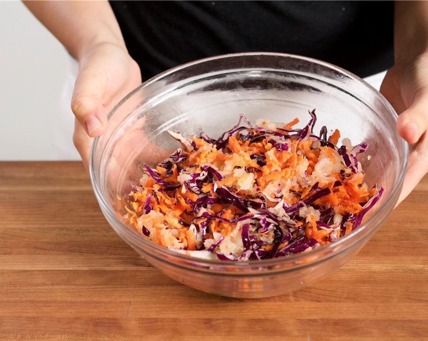 step 5 In the medium bowl with the onion pepper mix, add the Red Cabbage (1 1/2 cups), Black Caraway Seeds (1/2 tsp), and Ground Black Pepper (1/4 tsp).