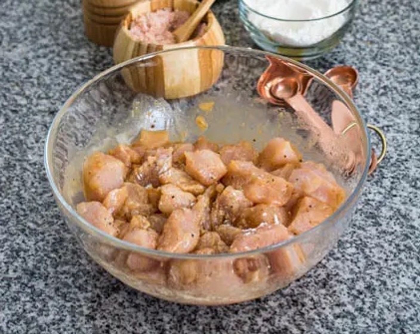 step 1 Pour Light Soy Sauce (2 Tbsp), Corn Starch (1 Tbsp), Salt (1/2 tsp), and Ground Black Pepper (1 dash) over the Chicken Breasts (1.5 lb) then stir until the chicken is well coated with the marinade. Allow marinating at room temperature for about 30 minutes.