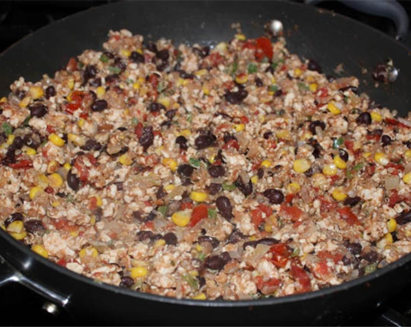 step 8 Add the black beans, Quinoa (1/2 cup), Canned Fire Roasted Diced Tomatoes (3/4 cup), Fresh Oregano (1/2 tsp), Mexican Chili Powder (1/2 tsp), Ground Cumin (1 tsp), and Cayenne Pepper (1 pinch). Cook for 2 minutes.