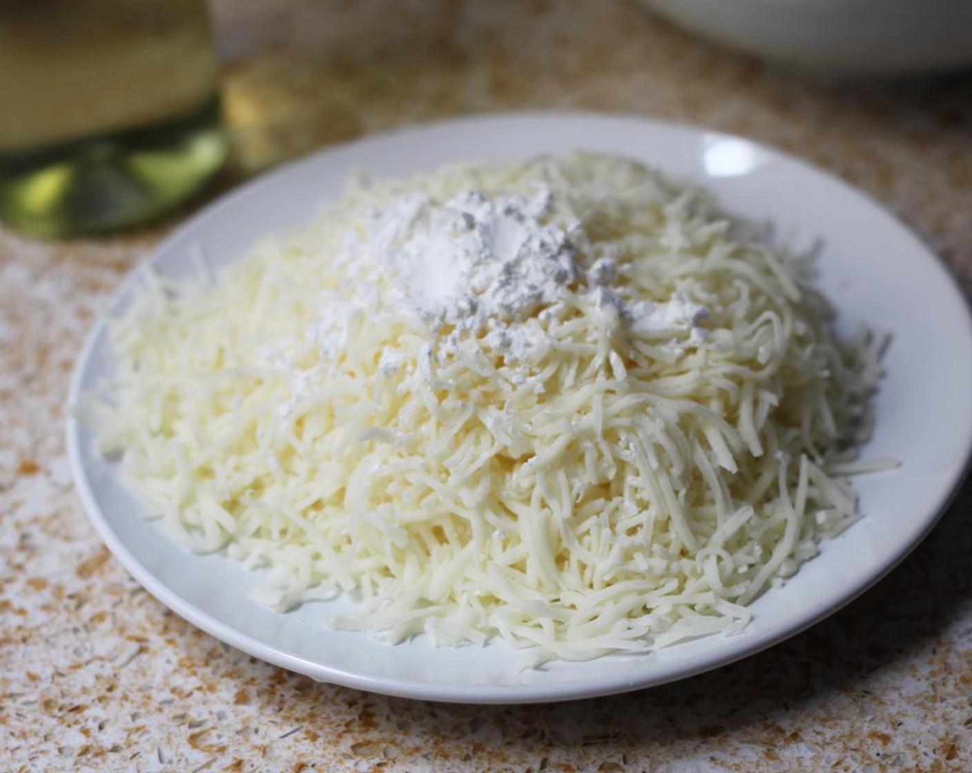 step 14 Combine the Shredded Mozzarella Cheese (2 2/3 cups) and Corn Starch (1 Tbsp).