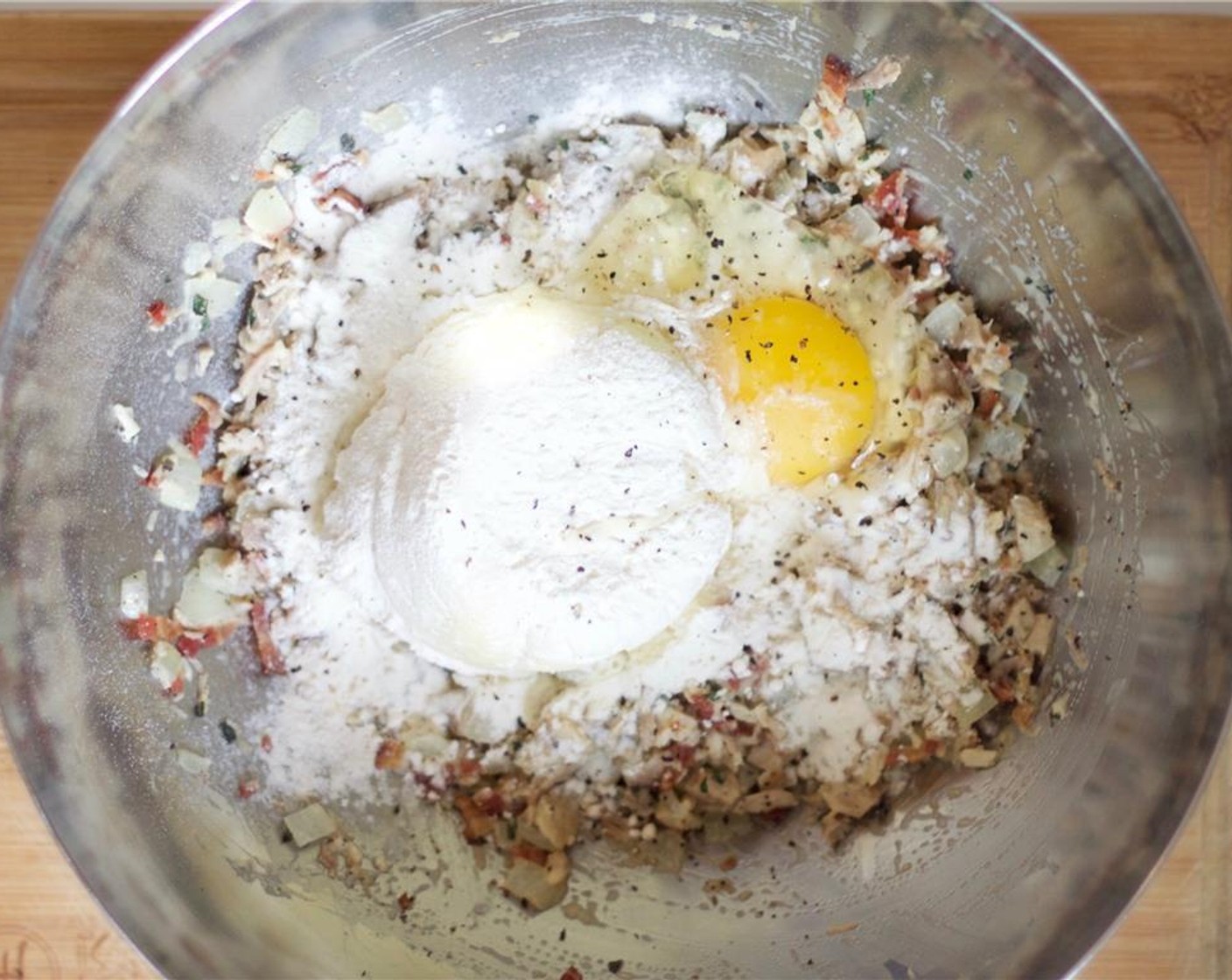 step 8 Add the Mashed Potatoes (1 cup), All-Purpose Flour (1/4 cup) and Egg (1) to the turkey mixture. Season with Kosher Salt (to taste) and Freshly Ground Black Pepper (to taste) and mix thoroughly.