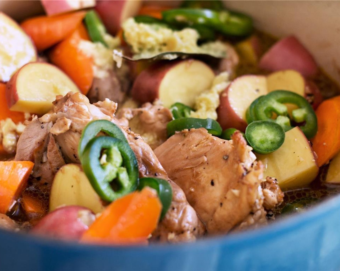 step 4 After all the chicken is browned, put it back in the pot along with the marinade, Water (3/4 cup), Carrots (4), and Potatoes (2). Turn the heat up until the liquid comes to a boil, then reduce to low heat and simmer for 45 minutes. Cook until the meat near the bone is no longer pink and the carrots and potatoes are cooked through.