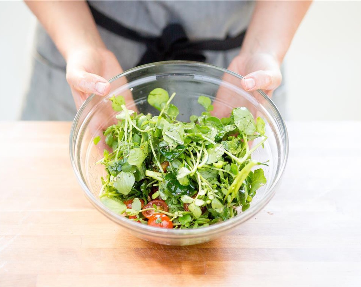 step 7 Remove two inches of the Watercress (1 bunch) stems and discard stems. Add to the bowl with the chilies, cilantro, and cherry tomatoes. Remove the marinade from the refrigerator and mix to combine. Add to the watercress salad.