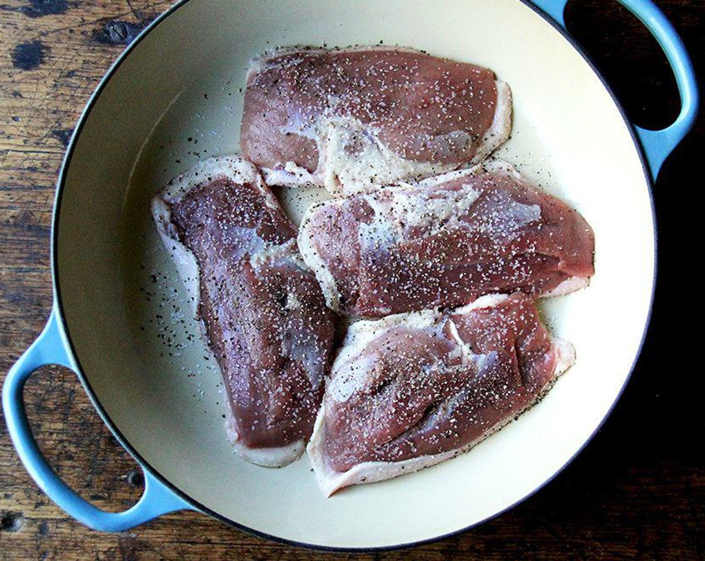 step 5 Place the skillet over low heat and cook for 3 minutes. Increase the heat to medium, and continue cooking until the duck begins to sizzle. Continue cooking undisturbed until the skin is browned, crisp, and has rendered most of its fat, 6 to 8 minutes.