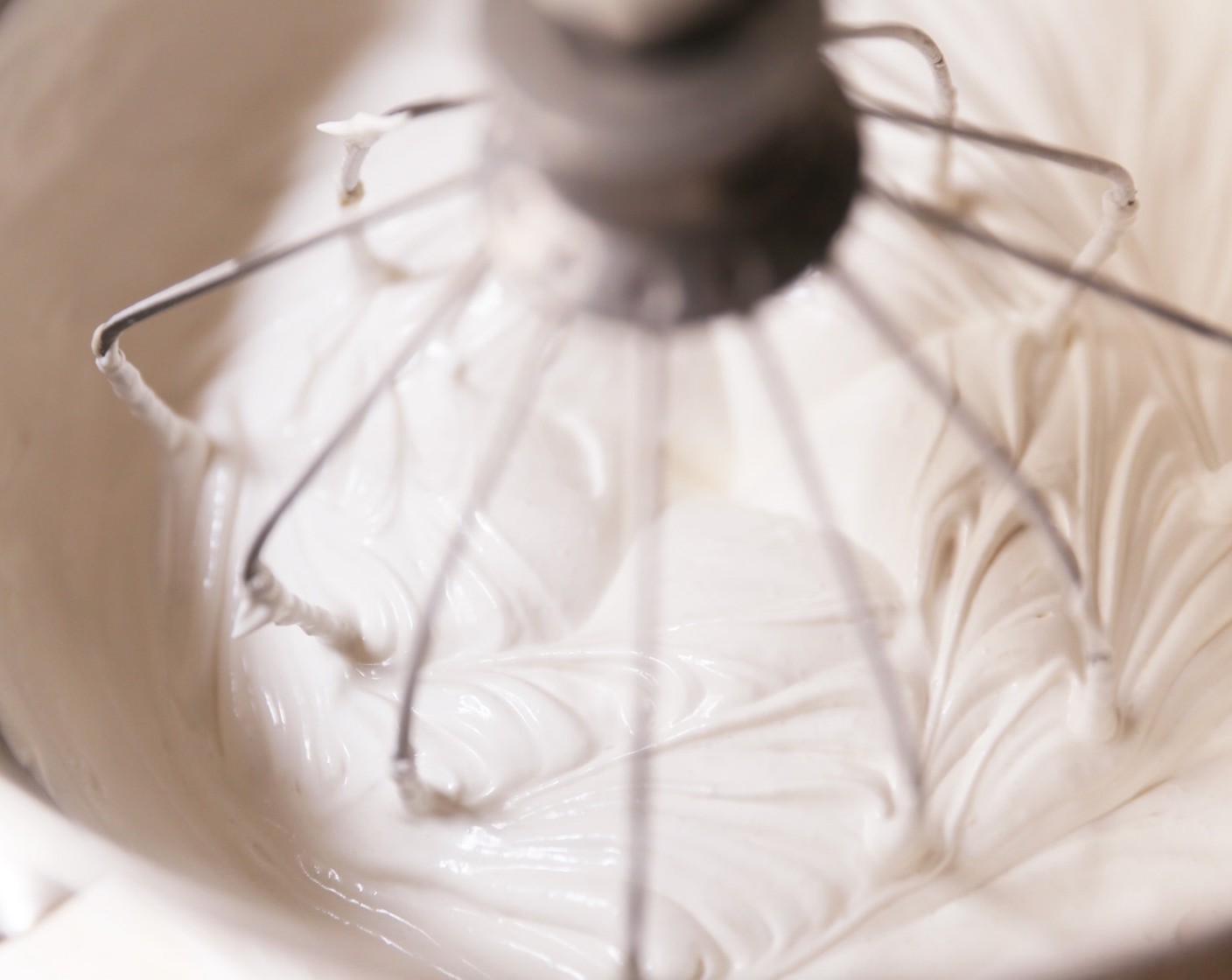 step 7 Continue mixing on a high speed until the meringue mixture is thick and glossy.