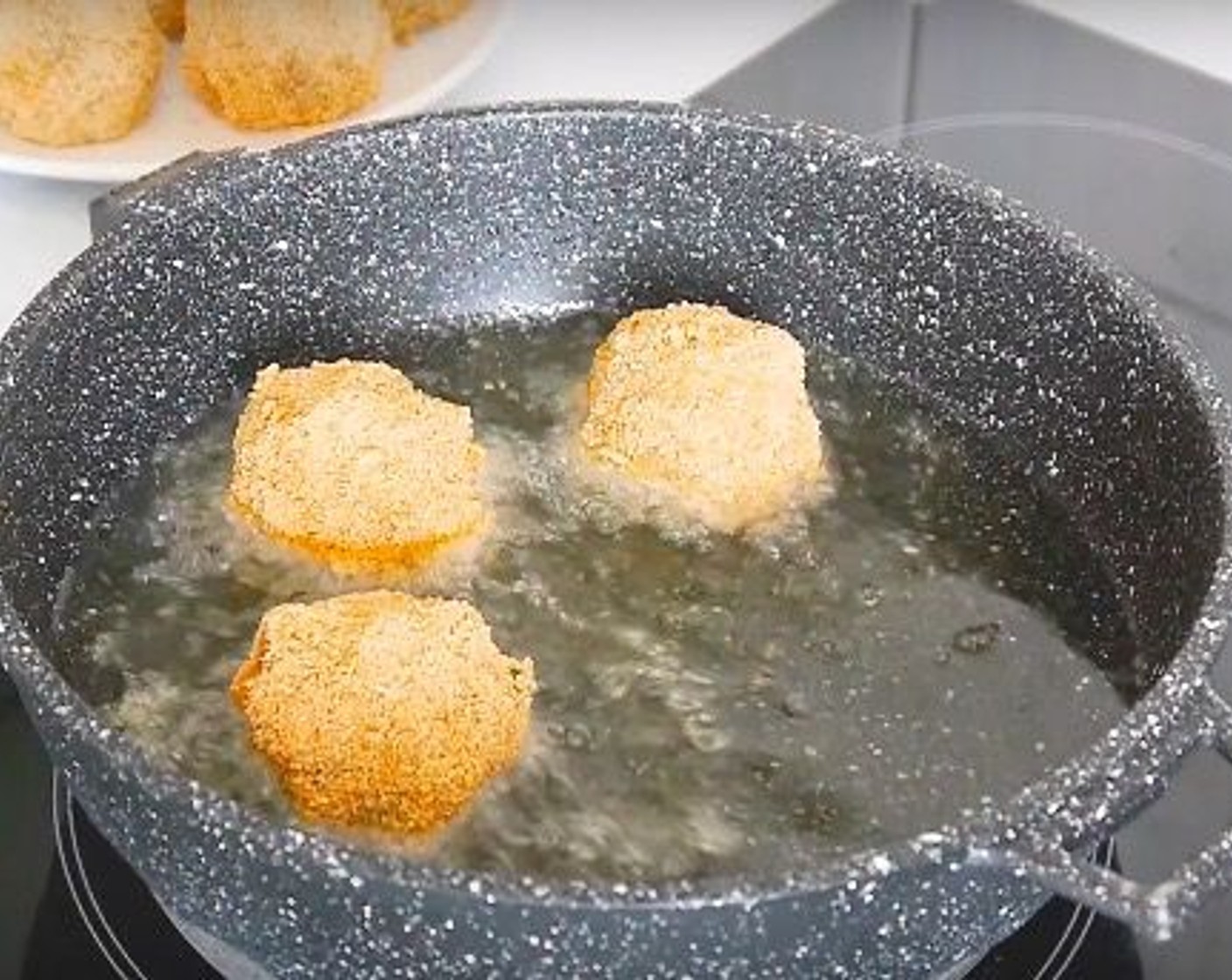 step 9 When the balls are golden brown remove from the oil and place over kitchen paper to absorb the excess oil. Serve and enjoy!