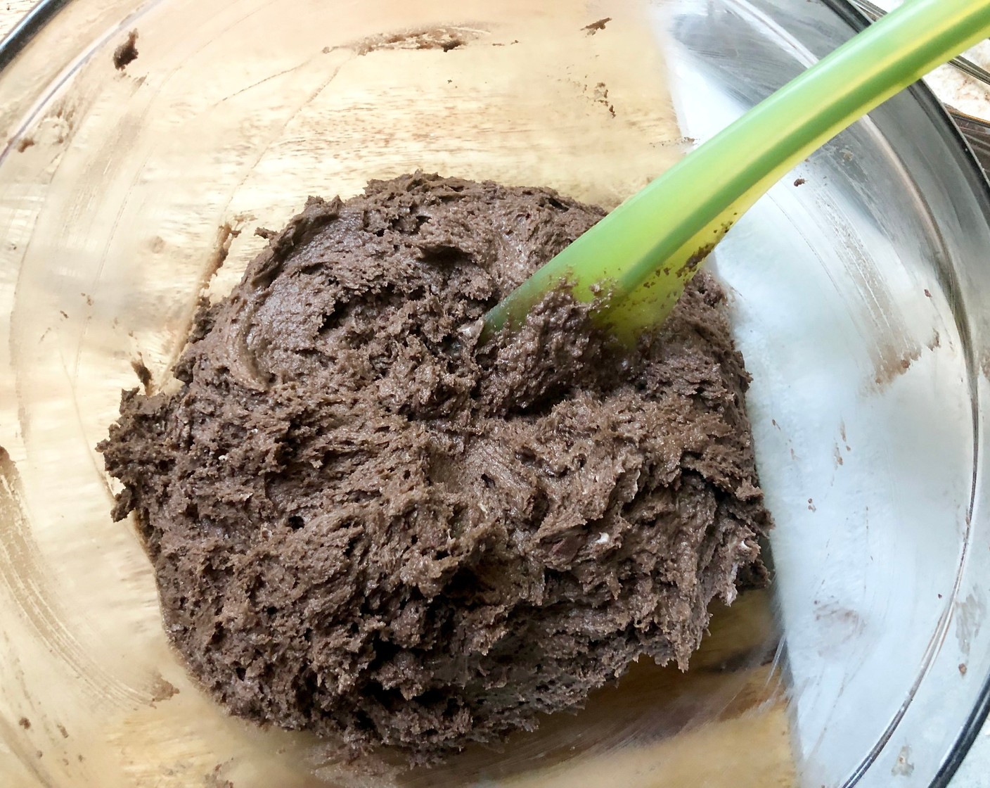 step 5 Pour the cream mixture into the butter-flour mixture and use a rubber spatula, followed by your hands, to mix and mash it together into one cohesive dough.